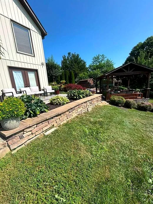 Backyard patio and stone wall area before finishing work
